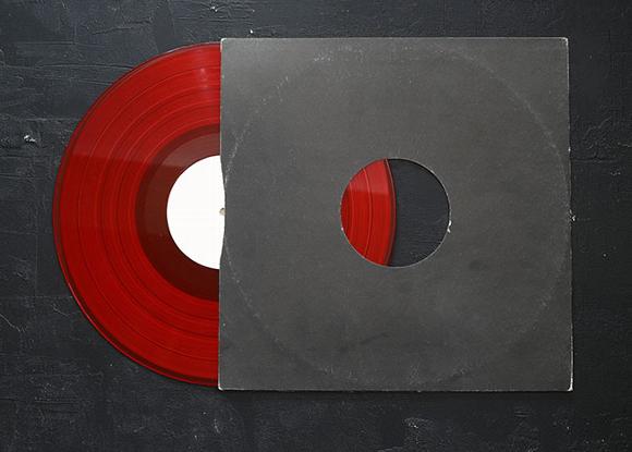 deep red vinyl half in a black vinyl sleeve